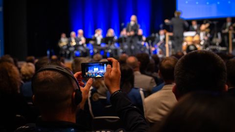 Spectator films the opening ceremony with a smartphone